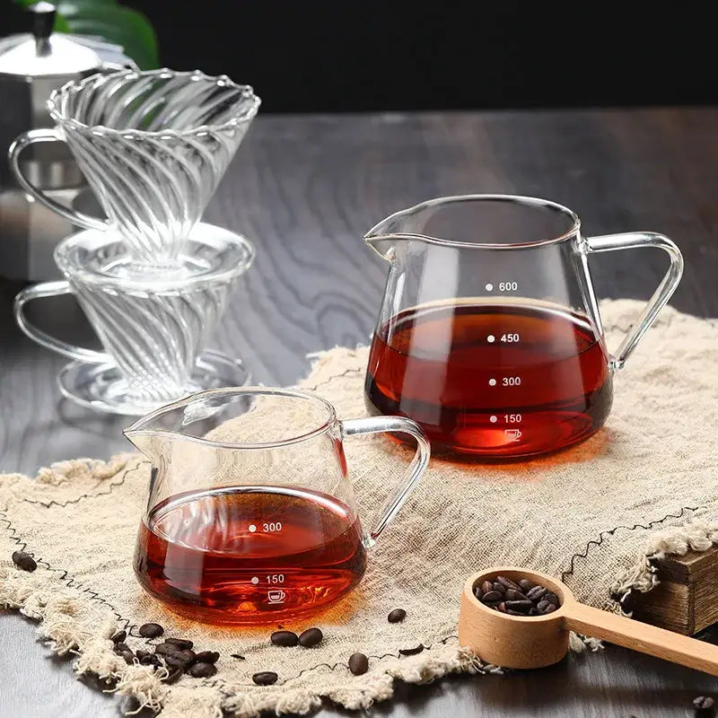 Fluted clear glass coffee pot featuring a twisted ribbed pour-over dripper with matching handle for brewing coffee
