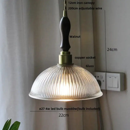 Fluted clear glass pendant light with brass finish featuring a warm-toned ribbed glass shade and dark walnut iron canopy for kitchen dining decorbites clear glass clear glass nordic