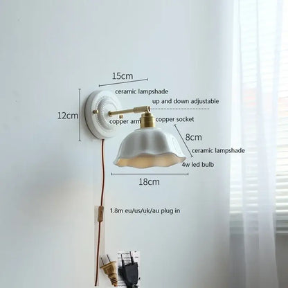 Fluted cream ceramic wall lamp with brass accents featuring an adjustable white ceramic lampshade for decorbites ceramic wall use