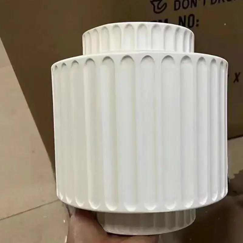 White ceramic vase with vertical fluted ridges and tiered shape for decorbites cream white led wall lamp bedroom decor