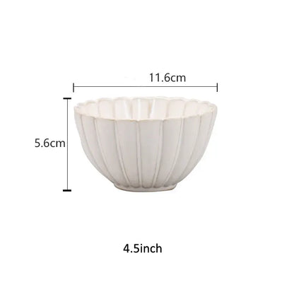 A white ceramic bowl with a fluted petal rim and vertical ridges from decorbites ceramic white dinnerware set
