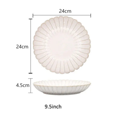 A white ceramic plate with scalloped edge and vertical ridges in the decorbites ceramic white dinnerware set