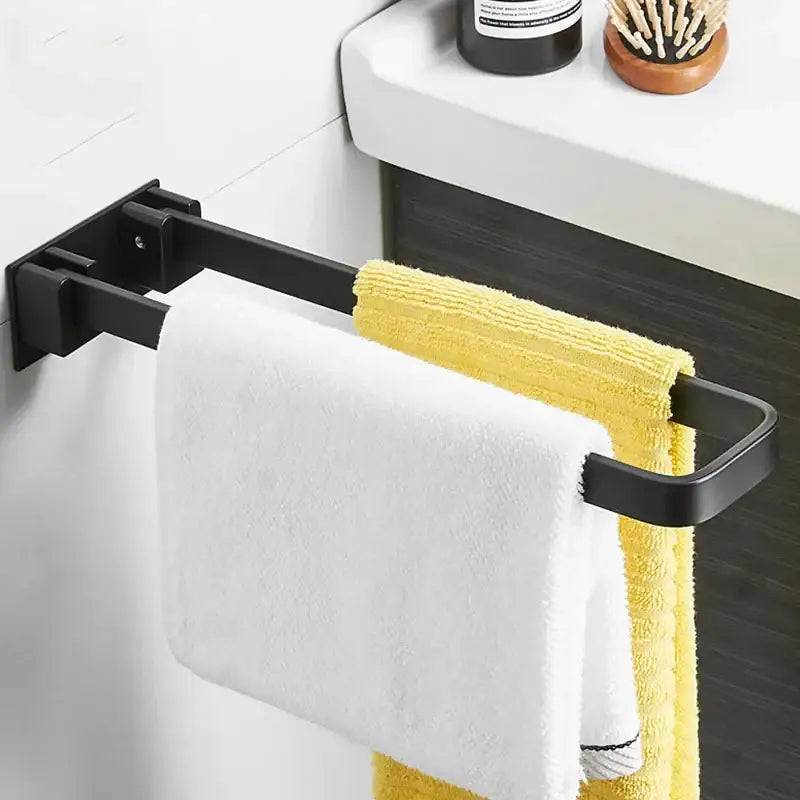 Black metal double towel rack holding white and yellow towels foldable single layer decorbites black aluminum bathroom bar