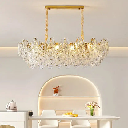 A gold-toned decorbites french chandelier pendant light with crystal pearl rose embellishments for bedroom decor