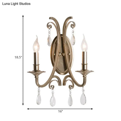 Antique brass finish two-light sconce light with crystal teardrop accents wall lamp for bedroom decor