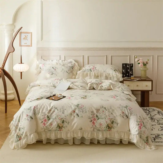 Cream-colored cotton bedding set with ruffled edges and pastel pink green beige blossoms for French country flowers decorbites