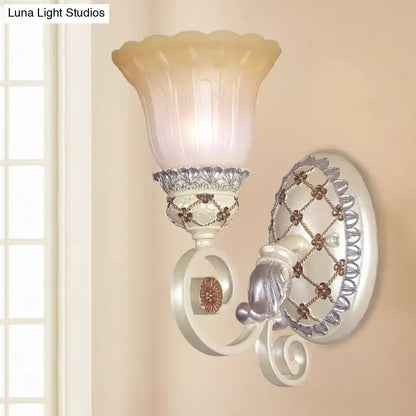Elegant white and silver wall sconce with frosted amber shade featuring opaline glass for living room gold light decor