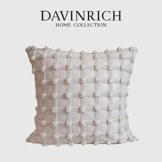 Off-white textured cushion cover with raised pom-poms and stitched lines from decorbites french cream bubble collection