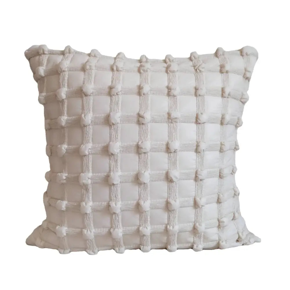 Cream-colored decorbites french cream cushion cover with textured french cream bubble pom-pom and ribbed pattern