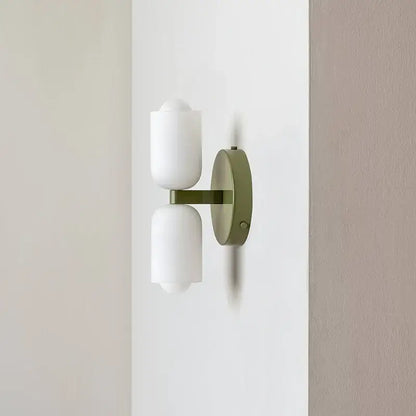 Modern olive green wall lamp with two frosted white cylindrical shades decorbites french cream double brass design for bedroom