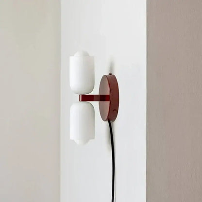 Modern french cream double headed brass wall lamp with frosted glass shades on matte red metal arm for bedroom decorbites french cream
