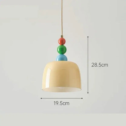 Cream style chandelier featuring a cream-colored ceramic pendant light with a slender brass chain and colorful beads decorbites french cream