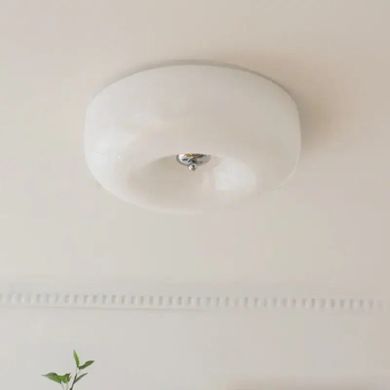 A sleek french cream ceiling lamp with white frosted glass and polished chrome center for bedroom decorbites french cream