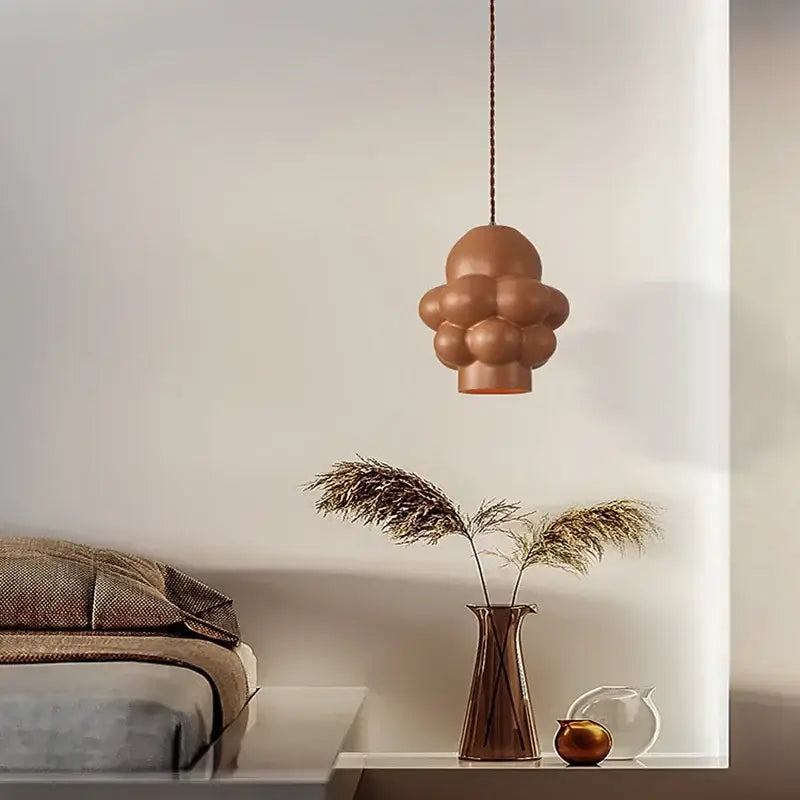 A modern copper-toned french creamy wind led cloud pendant light with bubble segments on a braided cord for dining room decorbites french creamy