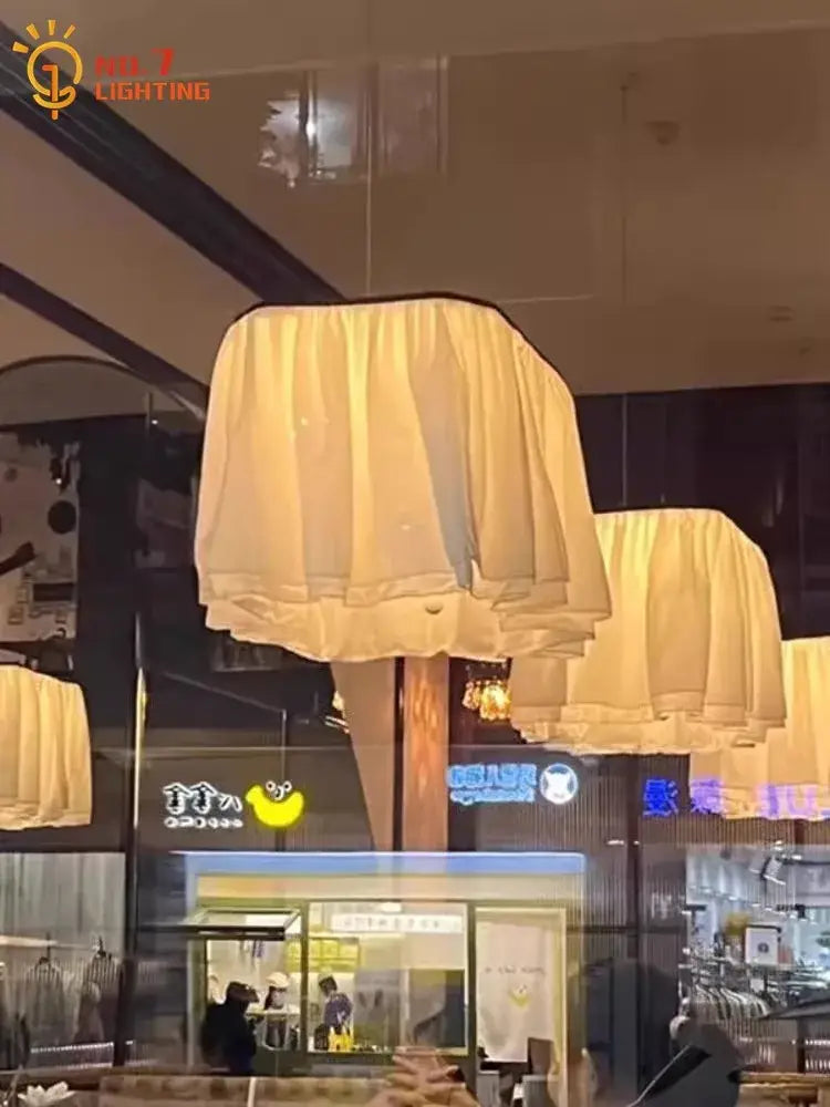 Cream-colored tiered fabric pendant light with soft draped design french design led pleated pendant lights decorbites