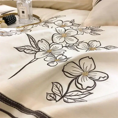 Cream-colored bedding set with delicate black and gold floral embroidery in decorbites french embroidered cotton style
