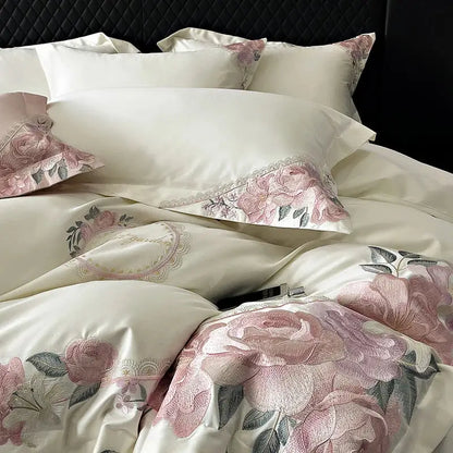 Cream-colored satin bedding set with pink rose embroidery and lace trim from decorbites french flowers embroidery collection