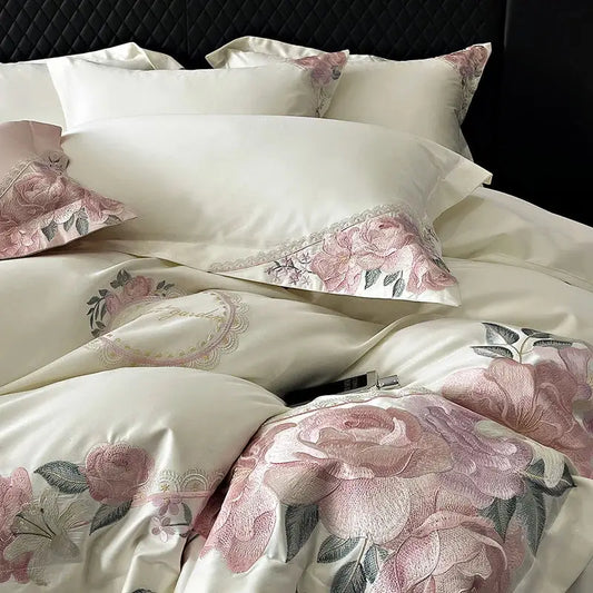 Cream-colored satin bedding set with pink rose embroidery and lace trim from decorbites french flowers embroidery collection