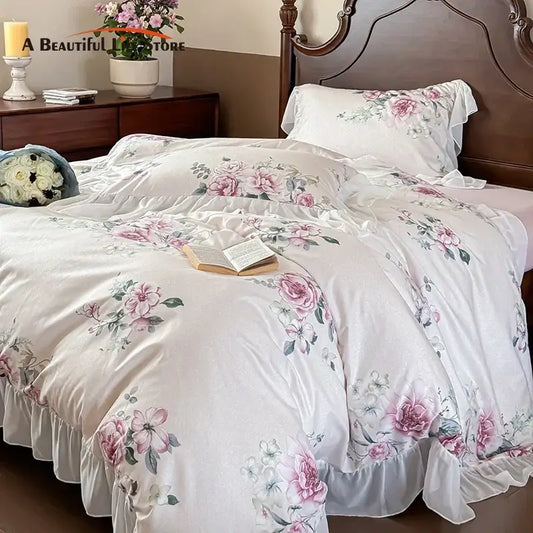 White satin bedding set with delicate pink and green floral embroidery and ruffled edges decorbites french flowers lace