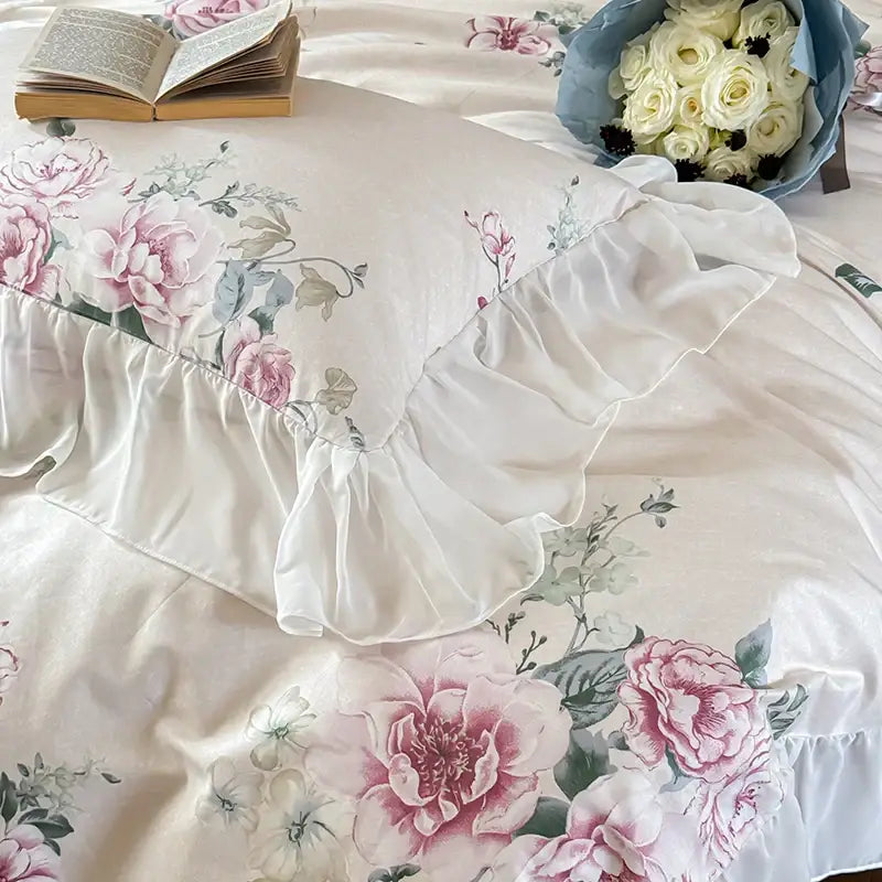 A cream pillow sham with pink and green floral embroidery and ruffled white edge from decorbites french flowers lace bedding set