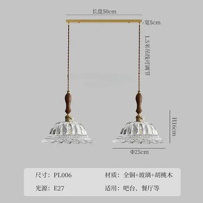 A pair of decorbites french ins walnut brass glass pendant lights with fluted clear shades and wooden handles for kitchen islands