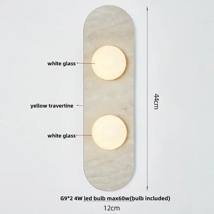 Modern wall light with two white glass bulbs on a yellow travertine panel by decorbites led wall light