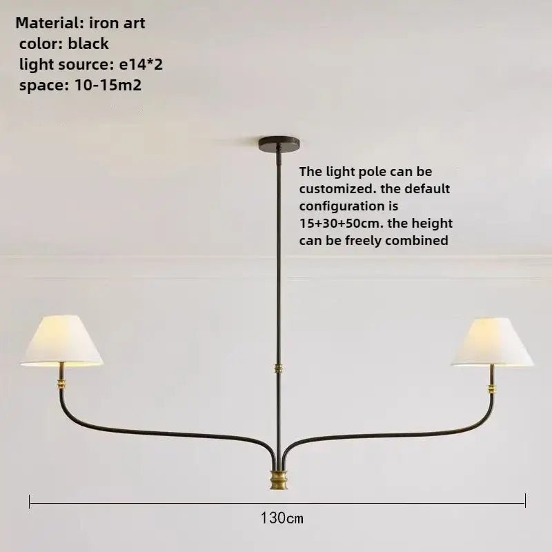 French minimalist black iron pendant light with brass accents and two white fabric shades for dining room use
