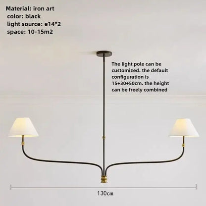 French minimalist black iron pendant light with brass accents and two white fabric shades for dining room use