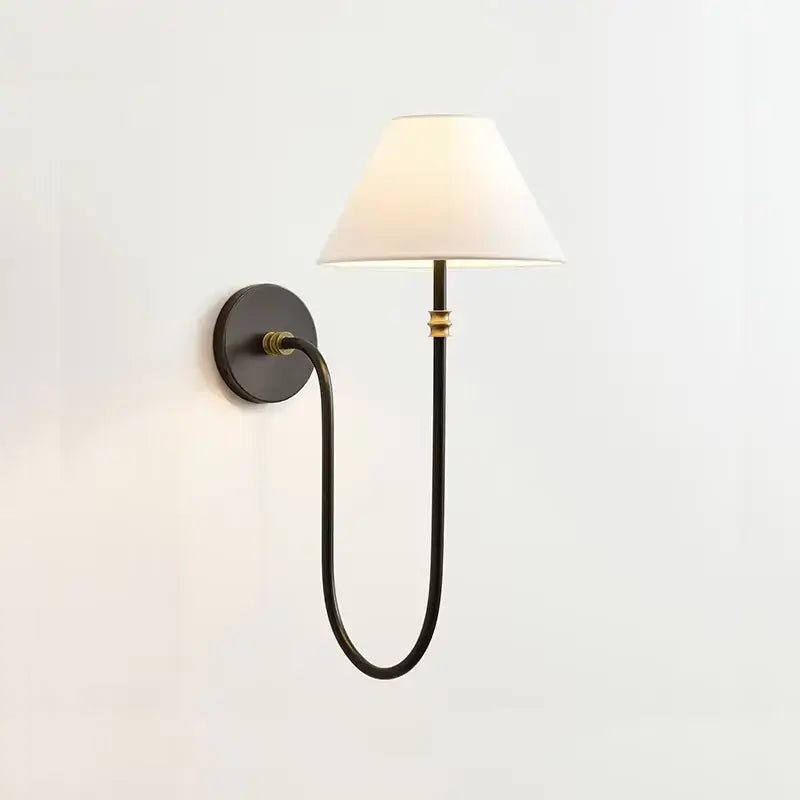 Black wrought iron sconce with brass accents and white fabric shade complementing french minimalist pendant light fabric shades