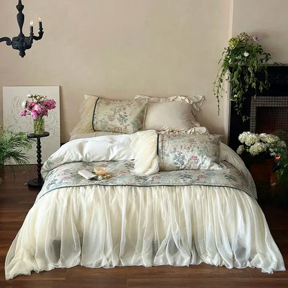 Cream-colored ruffled bed skirt with delicate floral pattern and sheer fabric in french princess lace ruffles bedding set