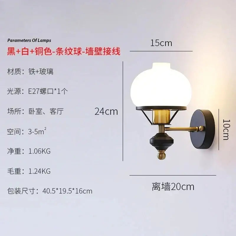 Black and brass-toned french retro wall lamp with frosted glass globe for living room wall sconce lighting