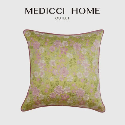 A light green square decorbites contessa camellia throw pillow with delicate pink white floral embroidery for living room decor