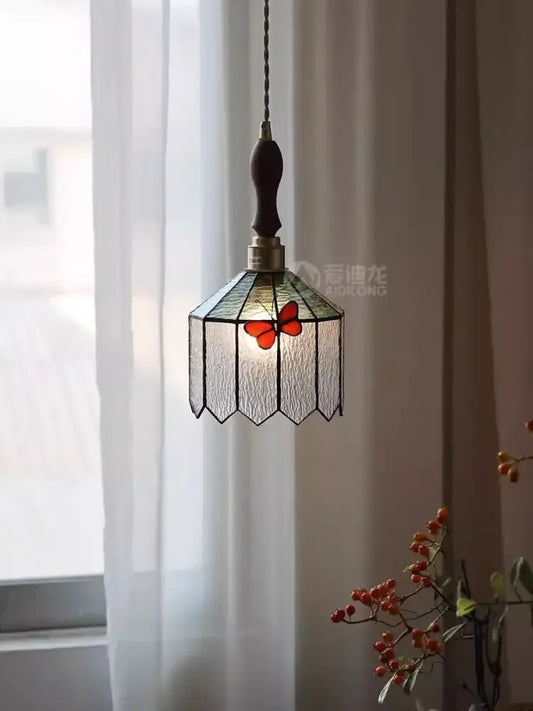 A french retro stained glass decorbites butterfly chandelier with orange butterfly motif and dark wooden handle