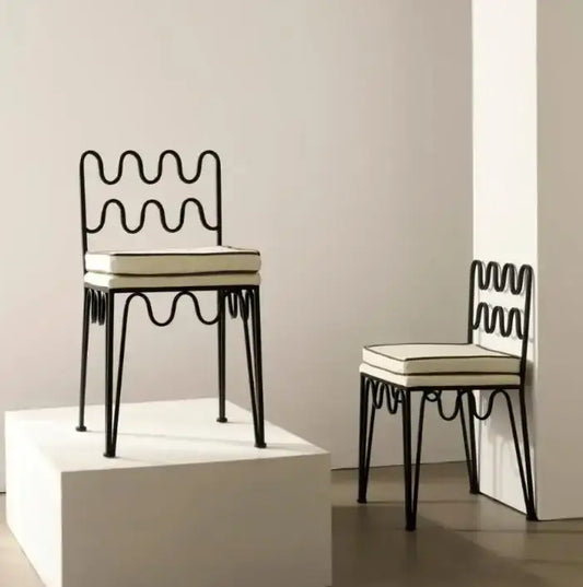Black wrought iron retro wave dining chair with cream upholstered seat from decorbites french retro dining table set