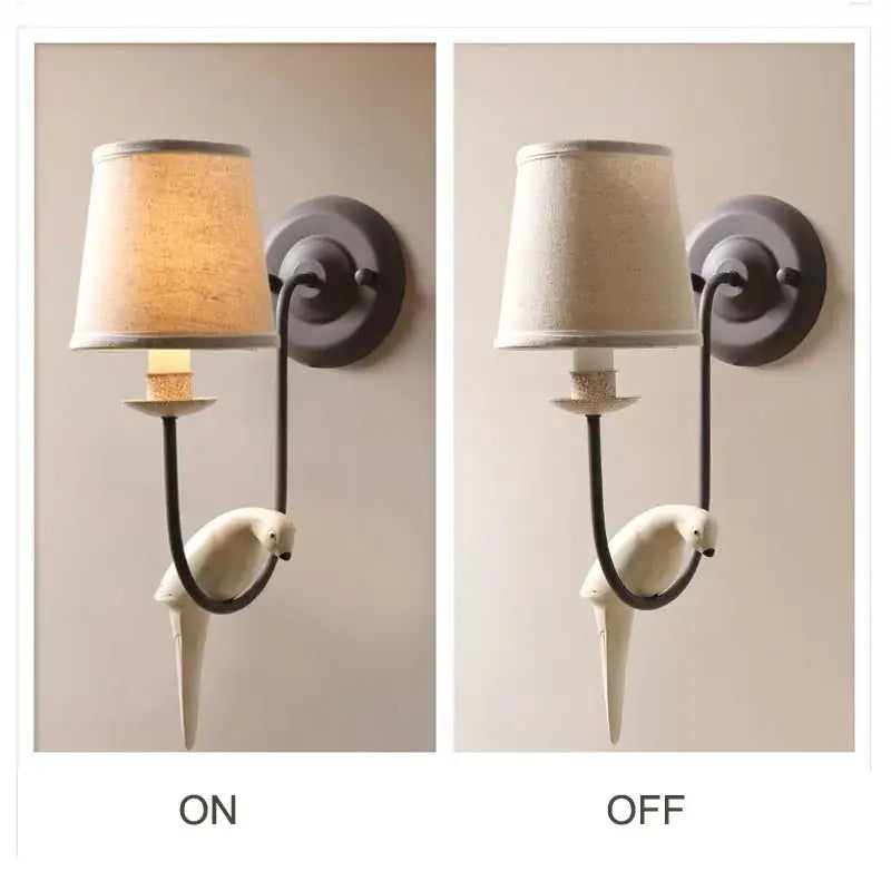 White ceramic parrot-shaped wall lamp with dark metal frame and fabric shade in bird decor antique style for bedroom decorbites