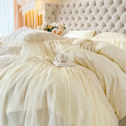 Cream-colored satin bedding set with delicate lace ruffles and subtle embroidery from decorbites french vintage collection