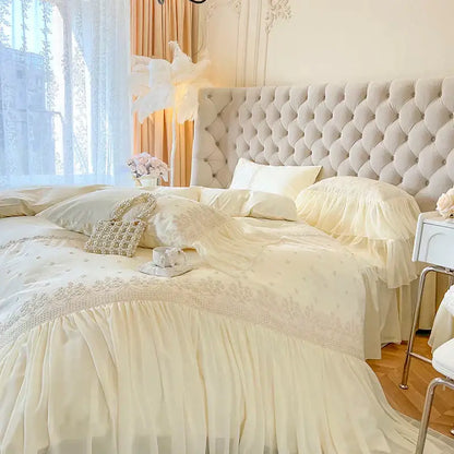 Cream-colored tufted headboard with soft upholstery and button detailing in decorbites french vintage lace ruffles bedding set decor