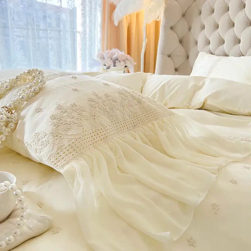 Cream-colored lace pillow sham with delicate floral embroidery and ruffled hem in decorbites french vintage bedding set