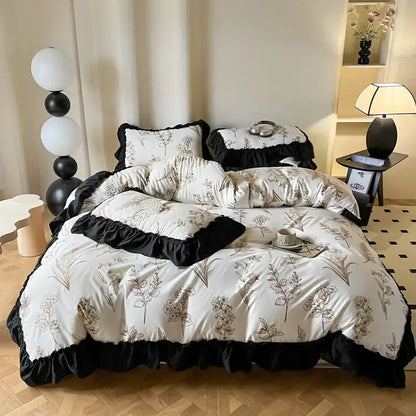 French vintage black and cream duvet cover set featuring white and black floral pattern with ruffled edges