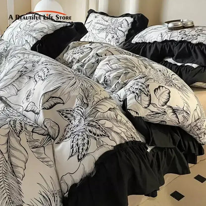 Black and cream french vintage duvet cover set with intricate botanical sketches and ruffled edges for bedroom bedding