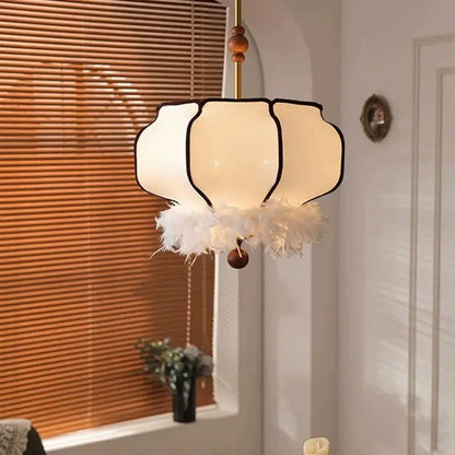 Delicate off-white petal-shaped vintage fabric chandelier with black trim and cream feather base for dining room decorbites french vintage