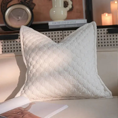 A plush white quilted pillow with diamond pattern and padded edges for decorbites french vintage magnolia bedroom decor