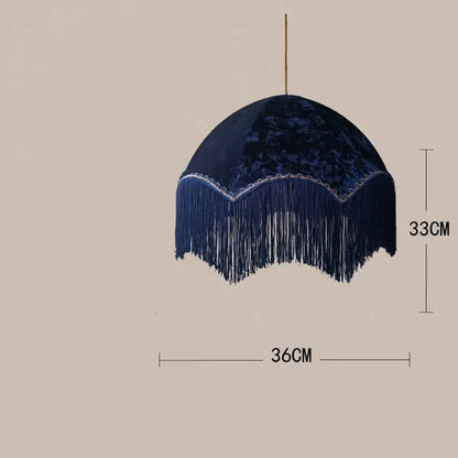 Deep navy velvet beauvamp tassel pendant light with cascading fringe detailing for living room decor