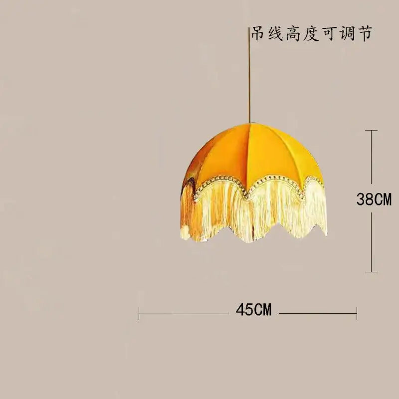 A charming yellow beauvamp tassel pendant light with fringed cream tassel trim and beaded edge for living room