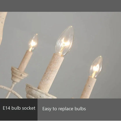White distressed french vintage wooden chandelier with three lit candle-style bulbs for dining room decorbites vintage wooden chandelier