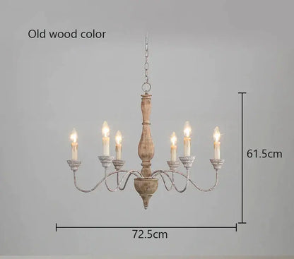 A rustic decorbites french vintage wooden chandelier with six candle-style lights and an old wood finish for dining rooms