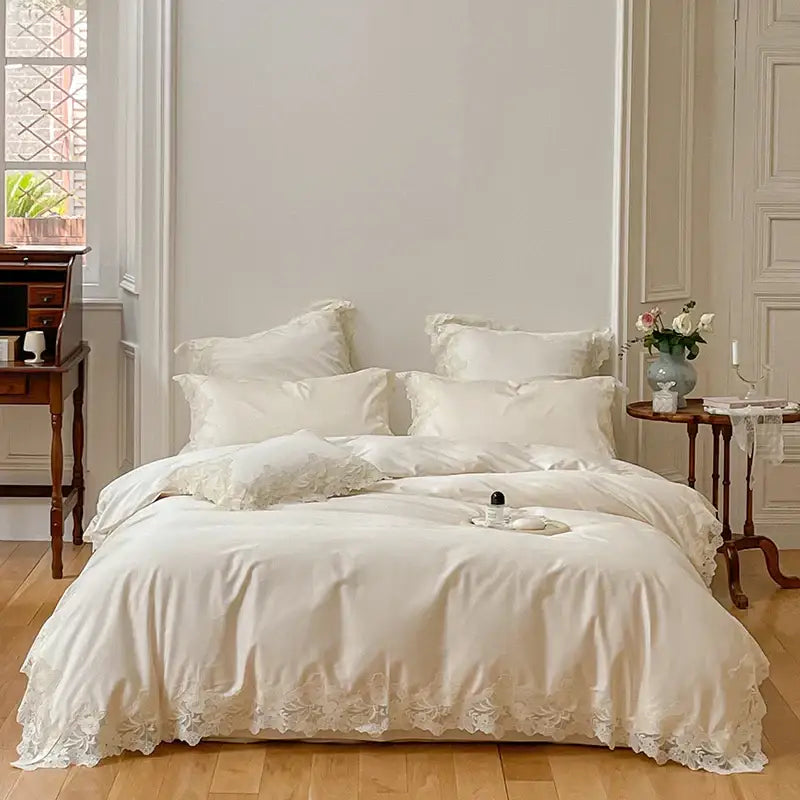 Cream-colored satin bedding set with delicate white lace trim decorbites french wedding chic duvet cover