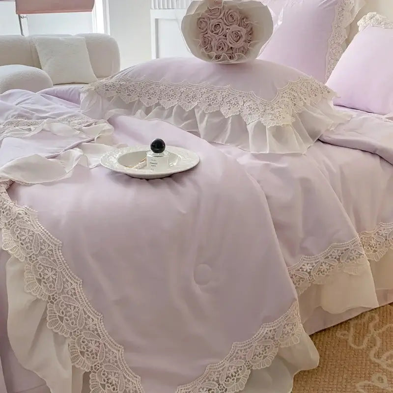 Lavender-colored bedding set with delicate white lace trim and ruffled edges in decorbites french wedding lace style