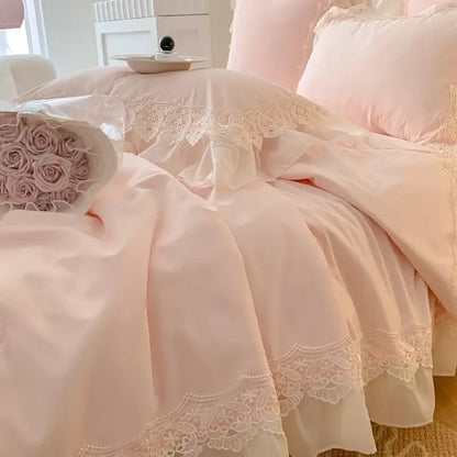 Pastel pink ruffled bedding set with delicate white lace trim featuring floral embroidery for decorbites french wedding lace