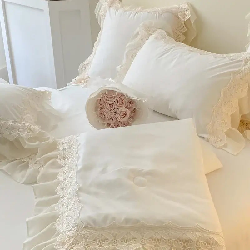 A delicate ivory lace-trimmed pillow sham with satin finish and ruffled edges from decorbites french wedding lace bedding set